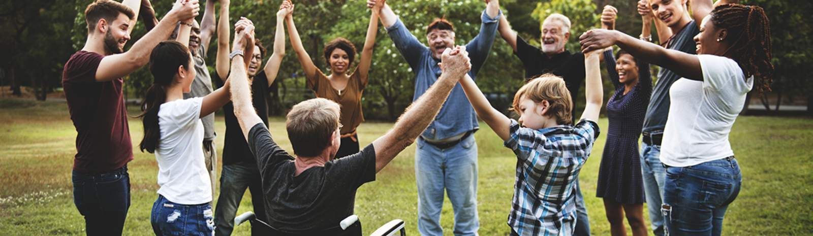 a group of people holding hands in a circle